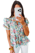 FESTIVAL OF FLOWERS TOP - Trendy & Stylish Boho Blouse by Teal Tiger Boutique $28.00 Elevate your style and comfort with our trendy boutique Festival of Flowers top. Elegant notch neckline, chic puffy sleeves, and a flattering peplum hem! Teal Tiger Bouti