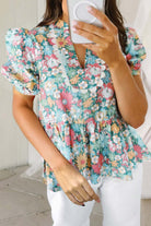 FESTIVAL OF FLOWERS TOP - Trendy & Stylish Boho Blouse by Teal Tiger Boutique $28.00 Elevate your style and comfort with our trendy boutique Festival of Flowers top. Elegant notch neckline, chic puffy sleeves, and a flattering peplum hem! Teal Tiger Bouti