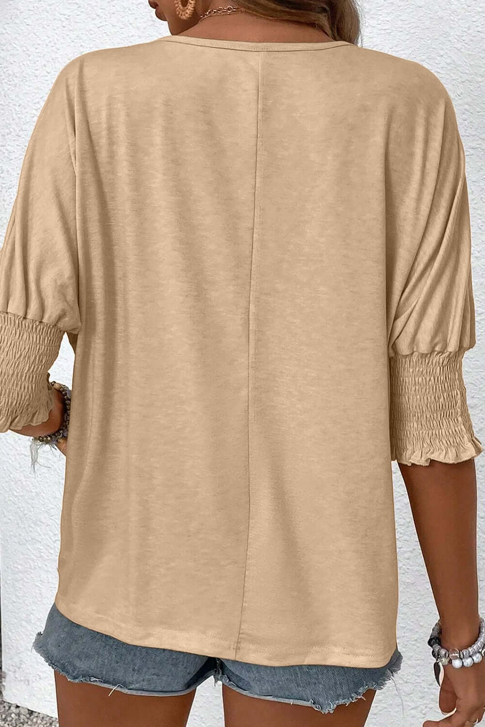 Timeless & Adaptable Blouse - CAUGHT MY ATTENTION TOP by Vivian-Lu $25.00 Unleash style and comfort with our trendy boutique blouse. Soft, stretchy fabric in neutral beige with chic pleats and shirred cuffs. Teal Tiger Boutique