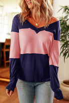 Woman wearing the BETTER DAYS Top by Vivian-Lu with V-neck and color-blocking design in pink and navy.