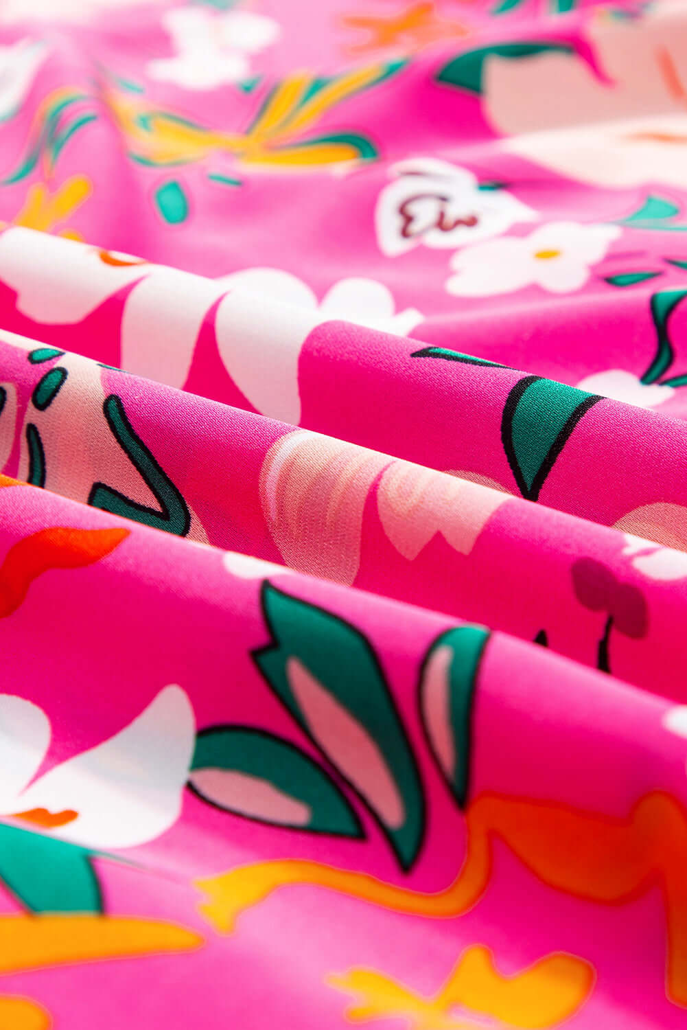 Vibrant rose floral fabric in pink featuring bold blooms, perfect for summer tops and cheerful outfits.