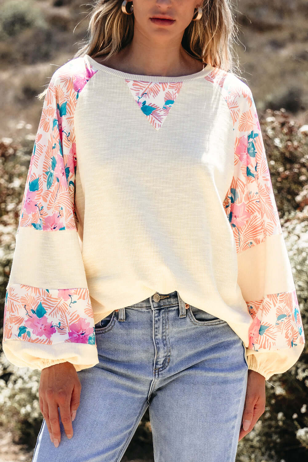 Lightweight vanilla Skye top with floral patchwork design and balloon sleeves, perfect for a stylish casual look.