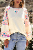 Lightweight vanilla Skye top with floral patchwork design and balloon sleeves, perfect for a stylish casual look.