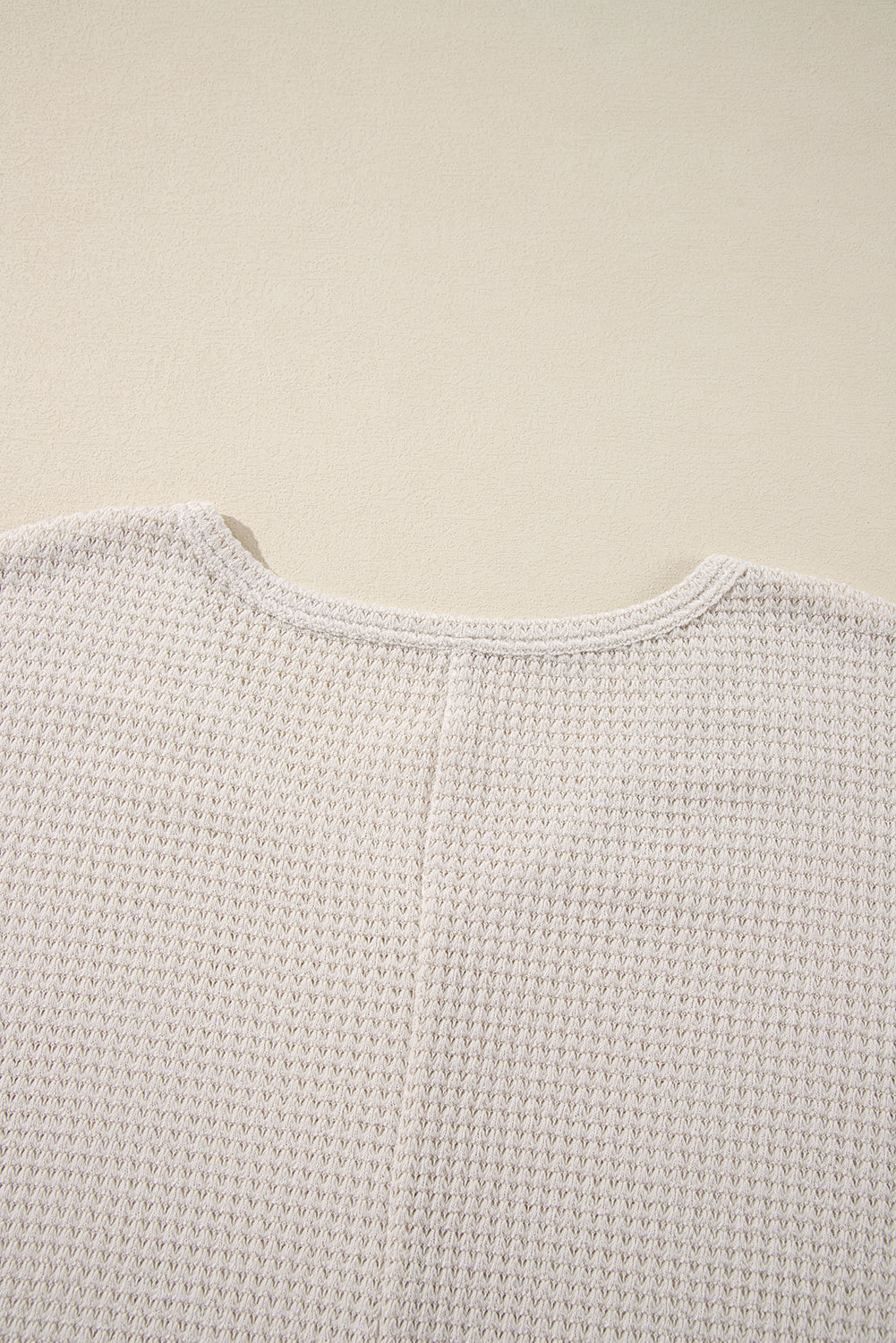 Close-up of Finally Made It Top in vanilla waffle knit fabric showing textured design and round neckline.