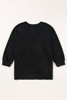 Back view of the black Finally Made It top featuring a soft waffle knit design and loose fit.