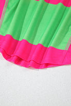 Pink and green colorblock top with striped pattern and drop shoulder design for versatile styling.