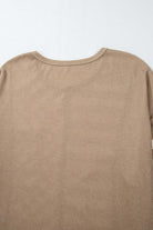 Back view of a brown top with a round neckline and long sleeves, made from soft fabric.