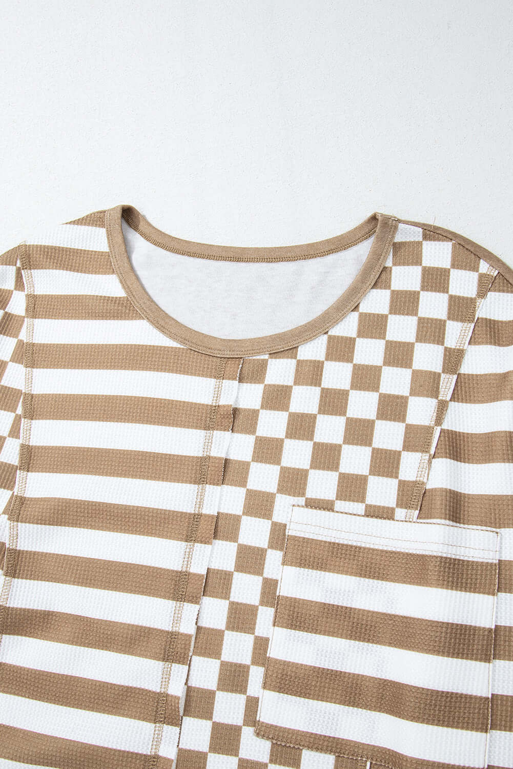 Checked Out Top with mixed checker and stripe patterns, unique patchwork details, and vintage-inspired lantern sleeves in polyester fabric.