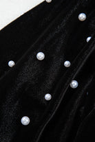 Close-up of luxurious black velvet fabric embellished with pearl beads for the Midnight Pearls Top.