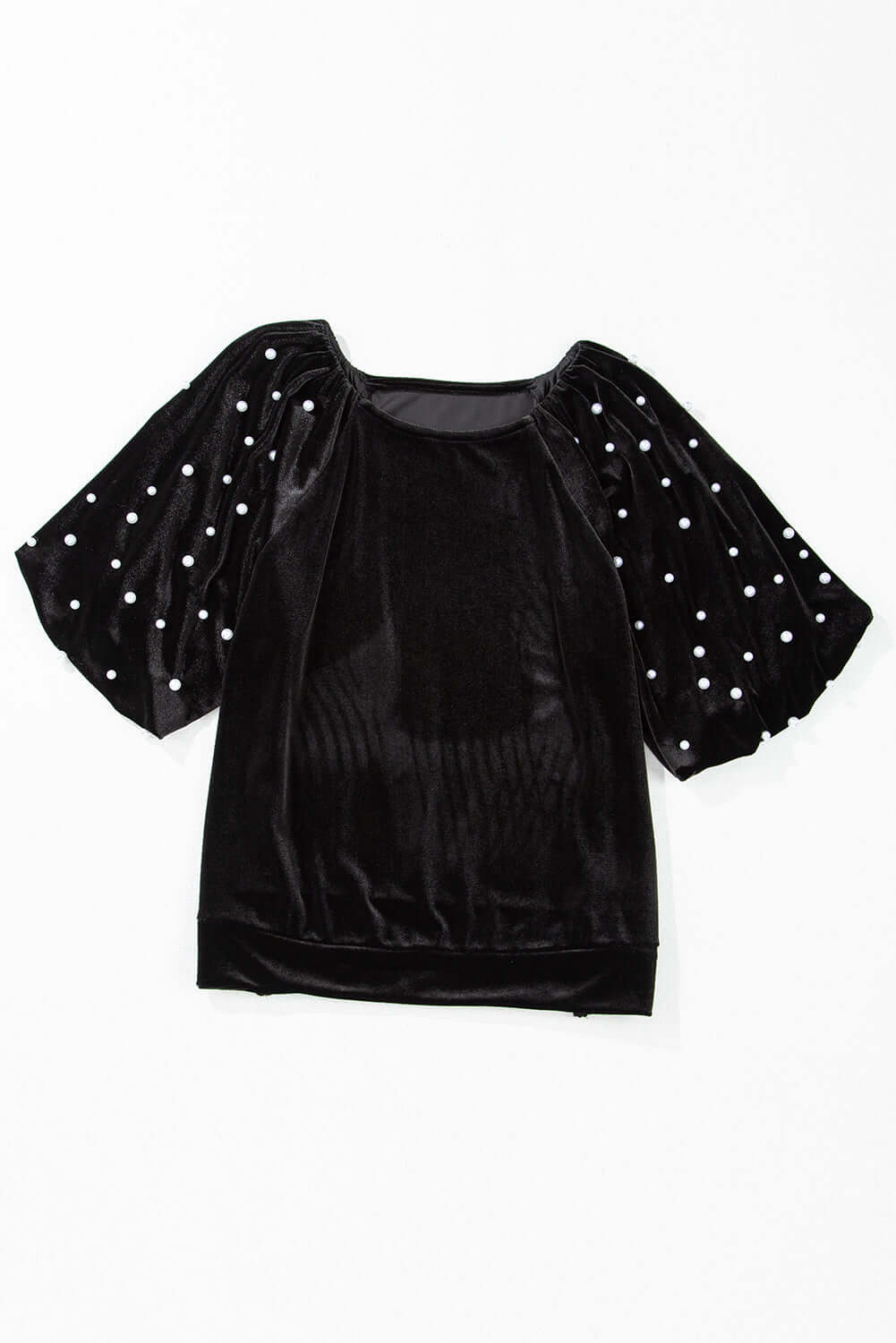 Elegant black velvet top with pearl embellishments and half puff sleeves, perfect for special occasions.