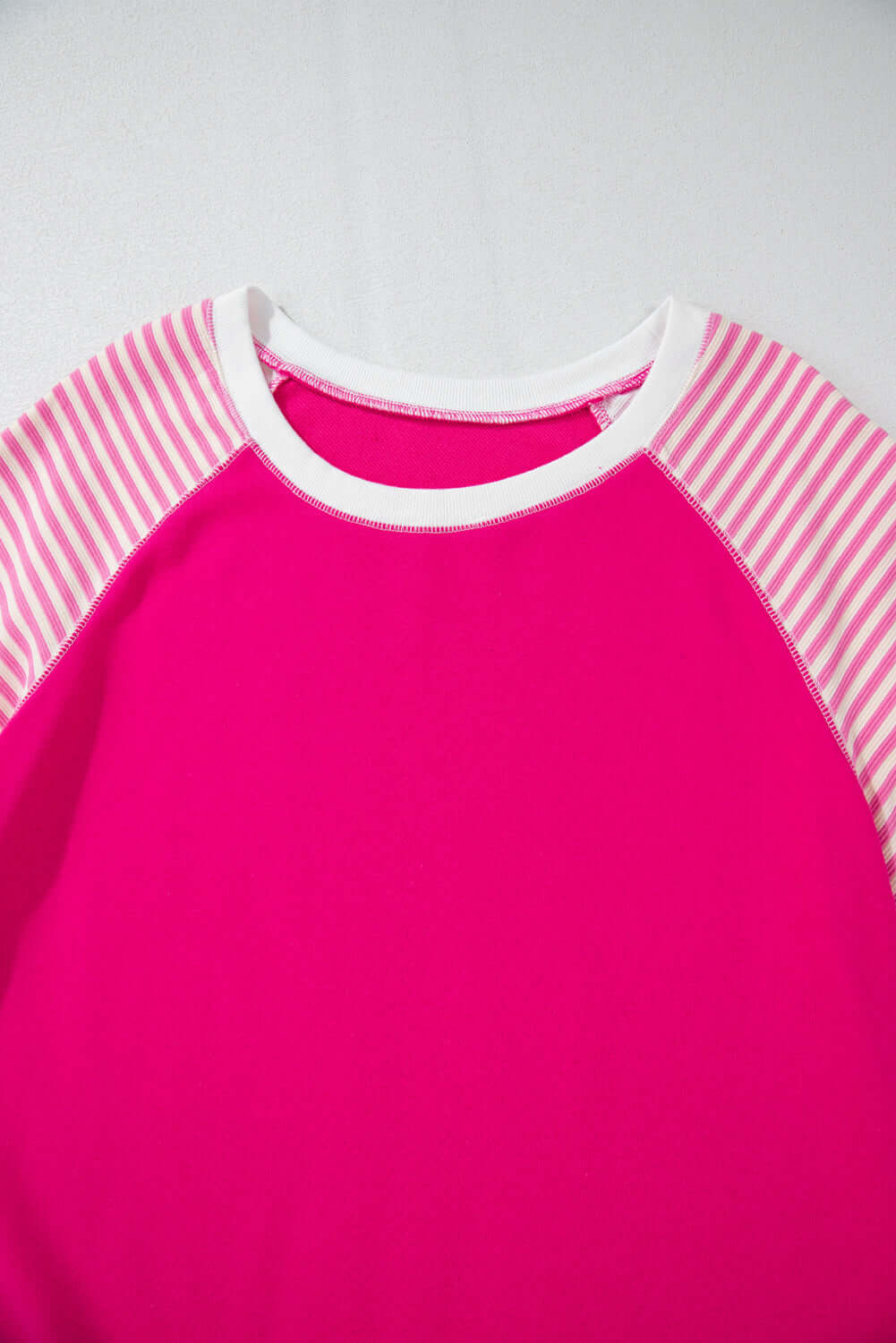 PROMISE YOU Top by Vivian-Lu featuring bold pink body and striped raglan sleeves for a sporty chic look.