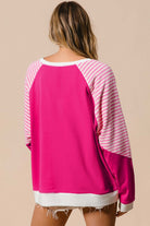 Back view of PROMISE YOU Top by Vivian-Lu featuring striped patchwork sleeves and a vibrant pink body.