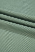 Soft ribbed fabric in a soothing green shade, showcasing texture for the Whispering Willow top.