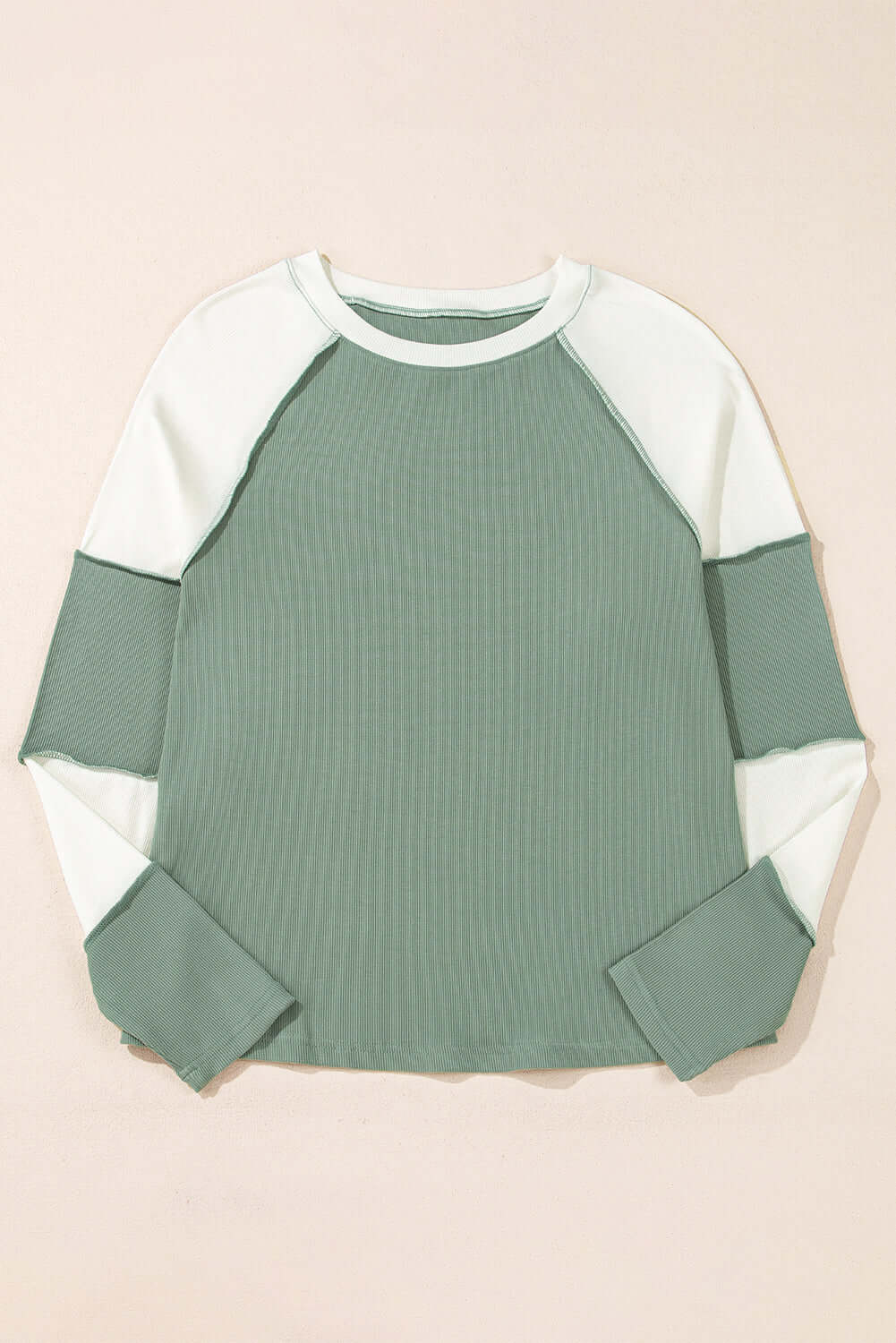 Whispering Willow top, green color block crew neck pullover with ribbed detailing and soft fabric. Perfect for everyday wear.