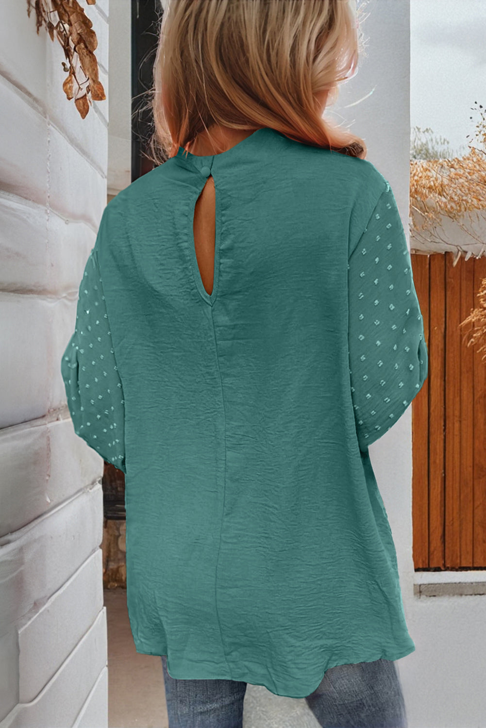 Aqua Autumn Breeze Top with keyhole back, balloon sleeves featuring Swiss dot pattern and gold button closure, worn by a woman.