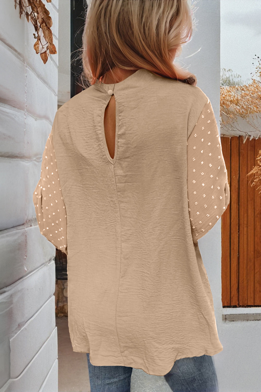 Beige blouse with balloon sleeves, Swiss dot pattern, and keyhole back with gold button closure. Sophisticated autumn look.