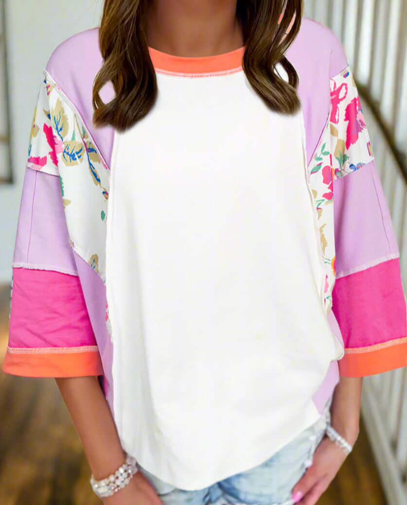 Color-blocked Enchanted Aura Top with floral prints and 3/4 sleeves, perfect for spring and casual outfits.