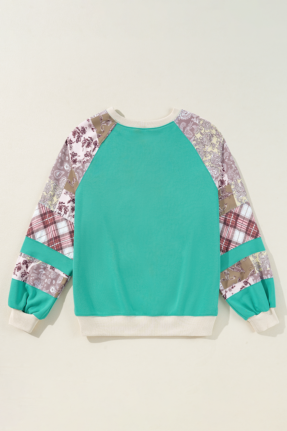 Malibu Marina top in teal with vintage plaid and paisley patchwork sleeves, showcasing a stylish color block raglan design.