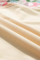 close-up of soft, beige fabric showcasing smooth texture, ideal for versatile clothing items like crewneck tops