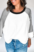 A Fine Line Top in white and black with patchwork design and striped raglan sleeves, perfect for casual occasions.