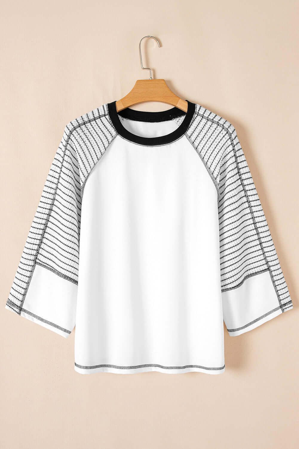 A Fine Line Top featuring patchwork design and striped raglan sleeves, perfect for casual occasions.