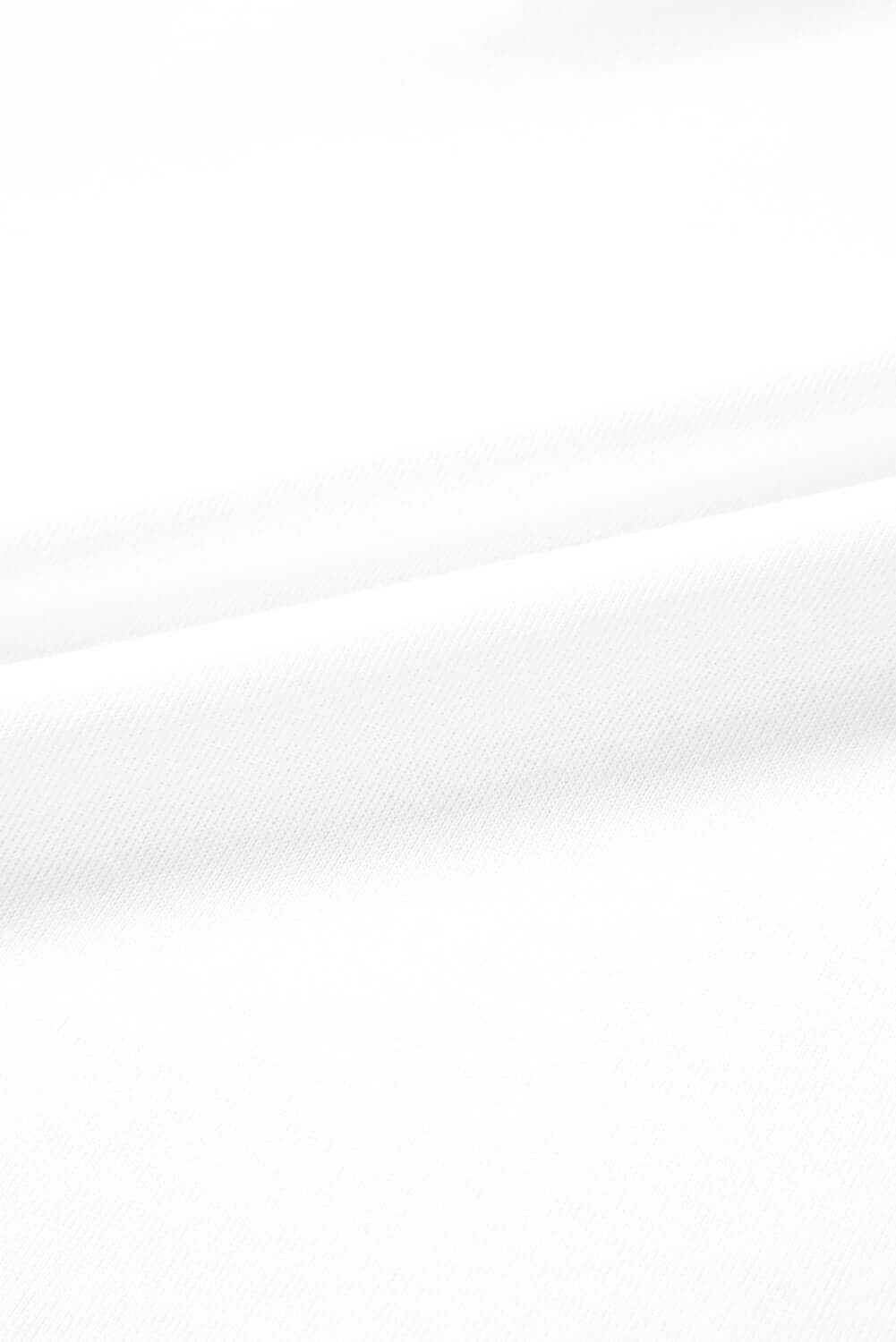 Close-up view of a fine quality white fabric, showcasing smooth texture ideal for stylish clothing.