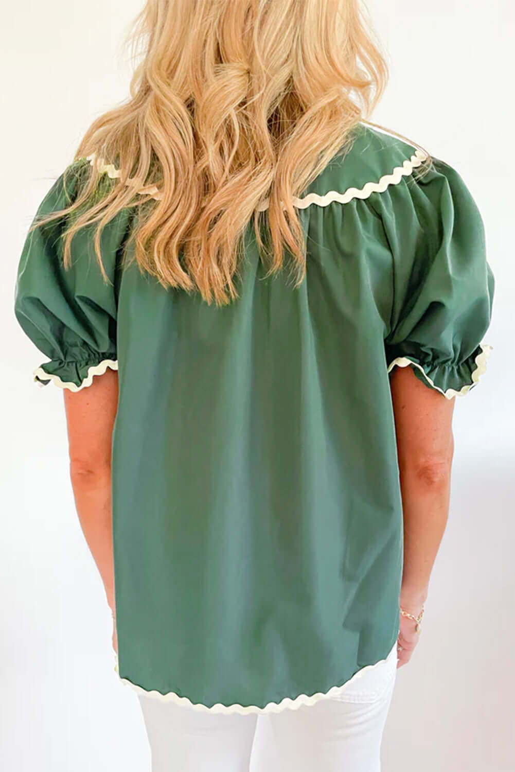 Back view of the Garden Gala Top in misty green with ivory trim and puff sleeves.