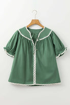 Misty green Garden Gala Top with ivory ric rac trim and short puff sleeves, showcasing a relaxed fit.