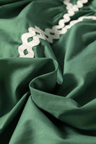 Misty green fabric of Garden Gala Top showcasing ivory ric rac trim detail for a vintage flair.