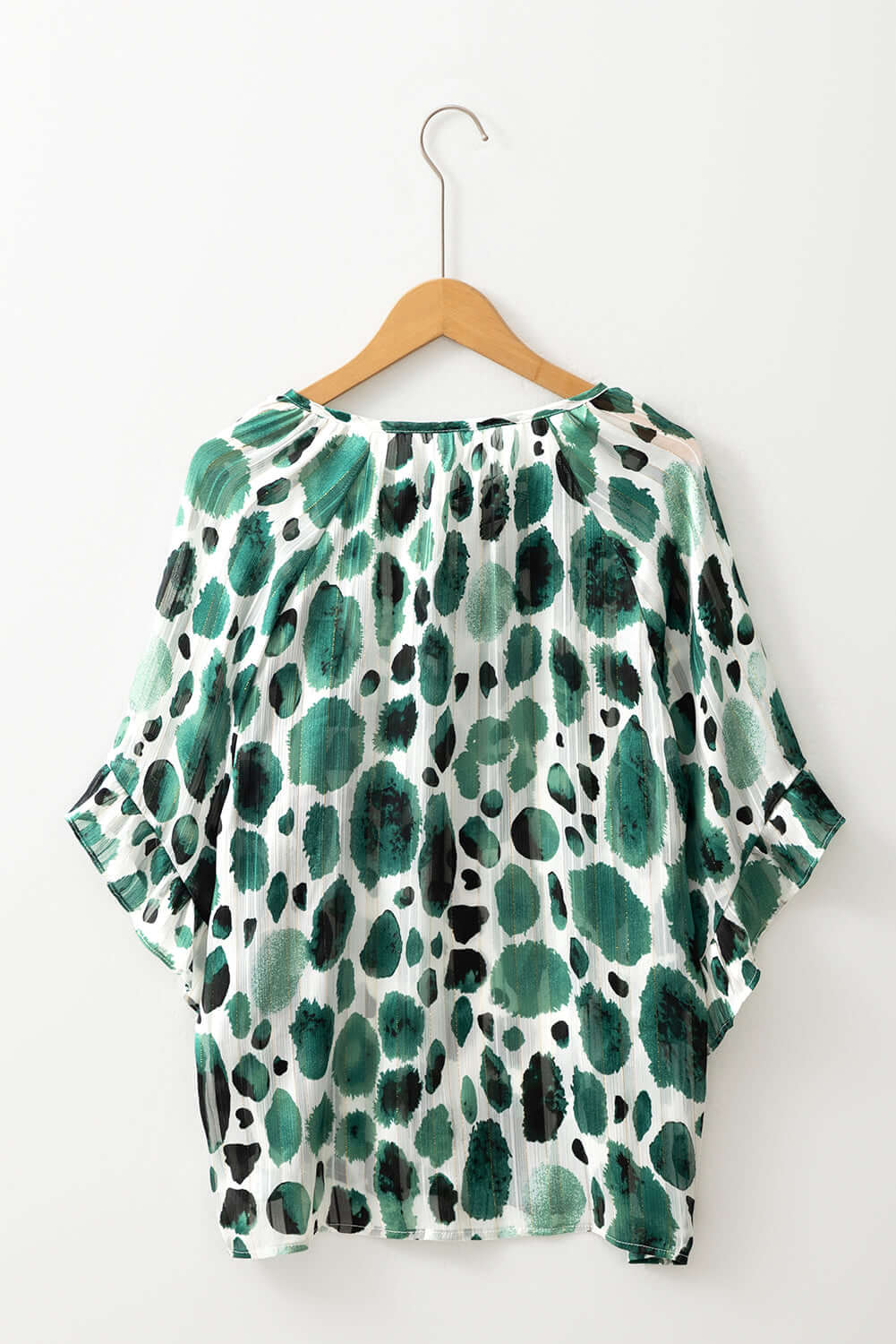 Women's Enchanted Valley blouse with 3/4 ruffled sleeves and playful spotted design.