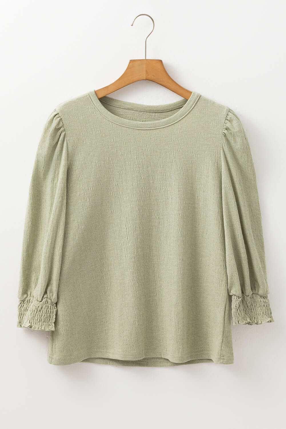 Alpine Mist top in minty sage with textured fabric and trendy half sleeves, perfect for any occasion.