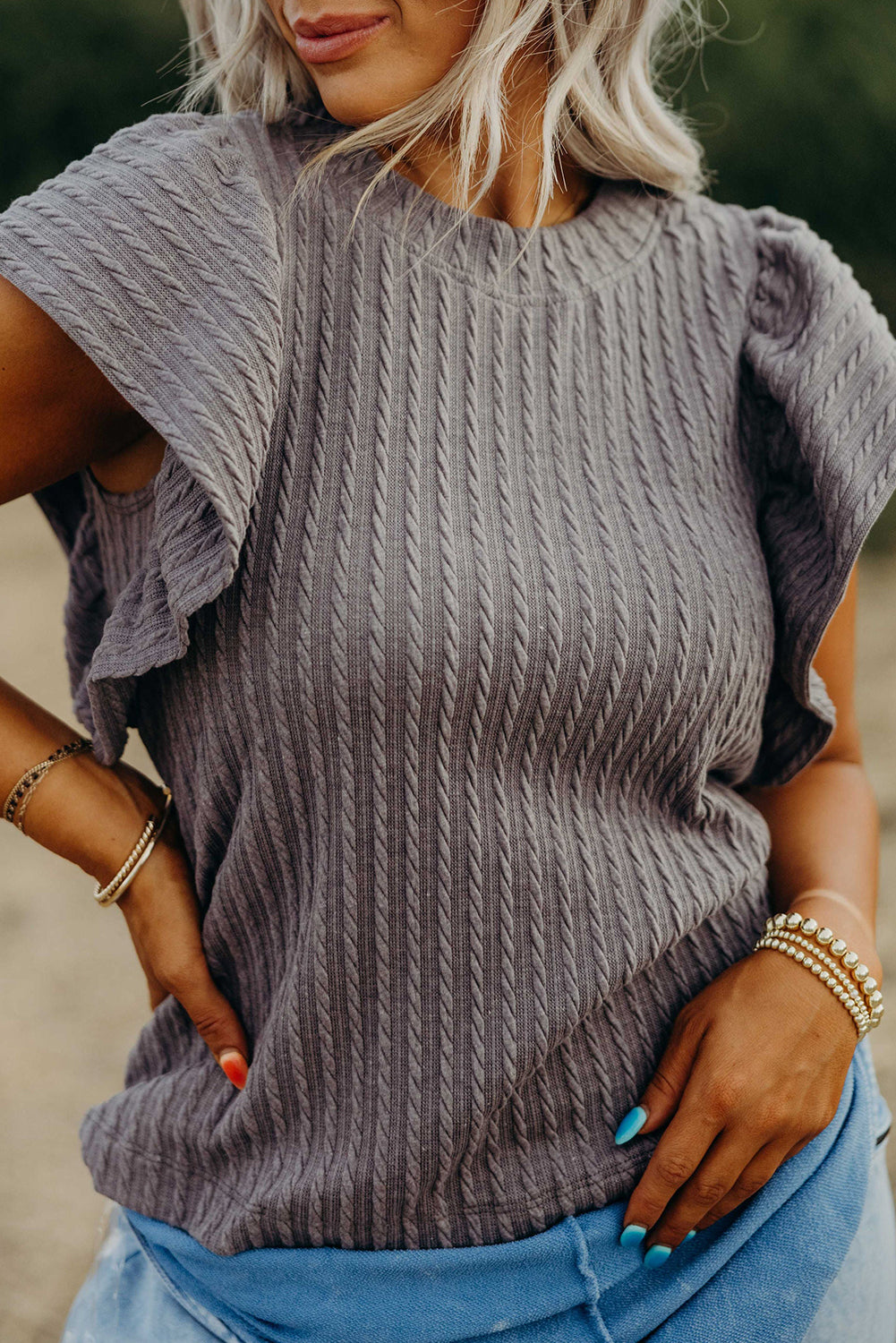 Chic taupe-gray Sound Wave top with textured ruffle sleeves, perfect for effortlessly stylish outfits.