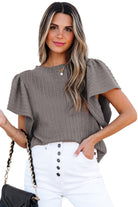 Sound Wave textured ruffle sleeve top in taupe-gray, styled with white denim and a chic handbag.