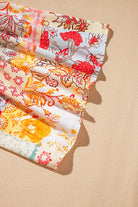 Colorful floral patchwork fabric showcasing vibrant print designs for bohemian style fashion.