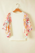 Sun Dance top featuring floral print batwing sleeves and a relaxed fit, perfect for bohemian style.