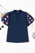 Navyblue Tide and Treasure Blouse with seashell and coral embroidery, frilled neck, and puff sleeves.