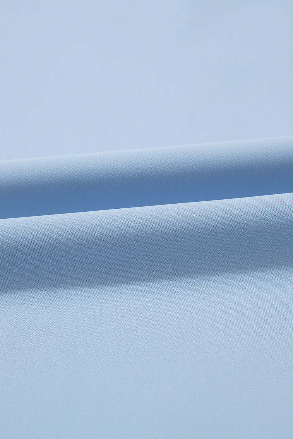 Soft sky blue polyester fabric, smooth finish perfect for stylish tops like the Frill Seeker.