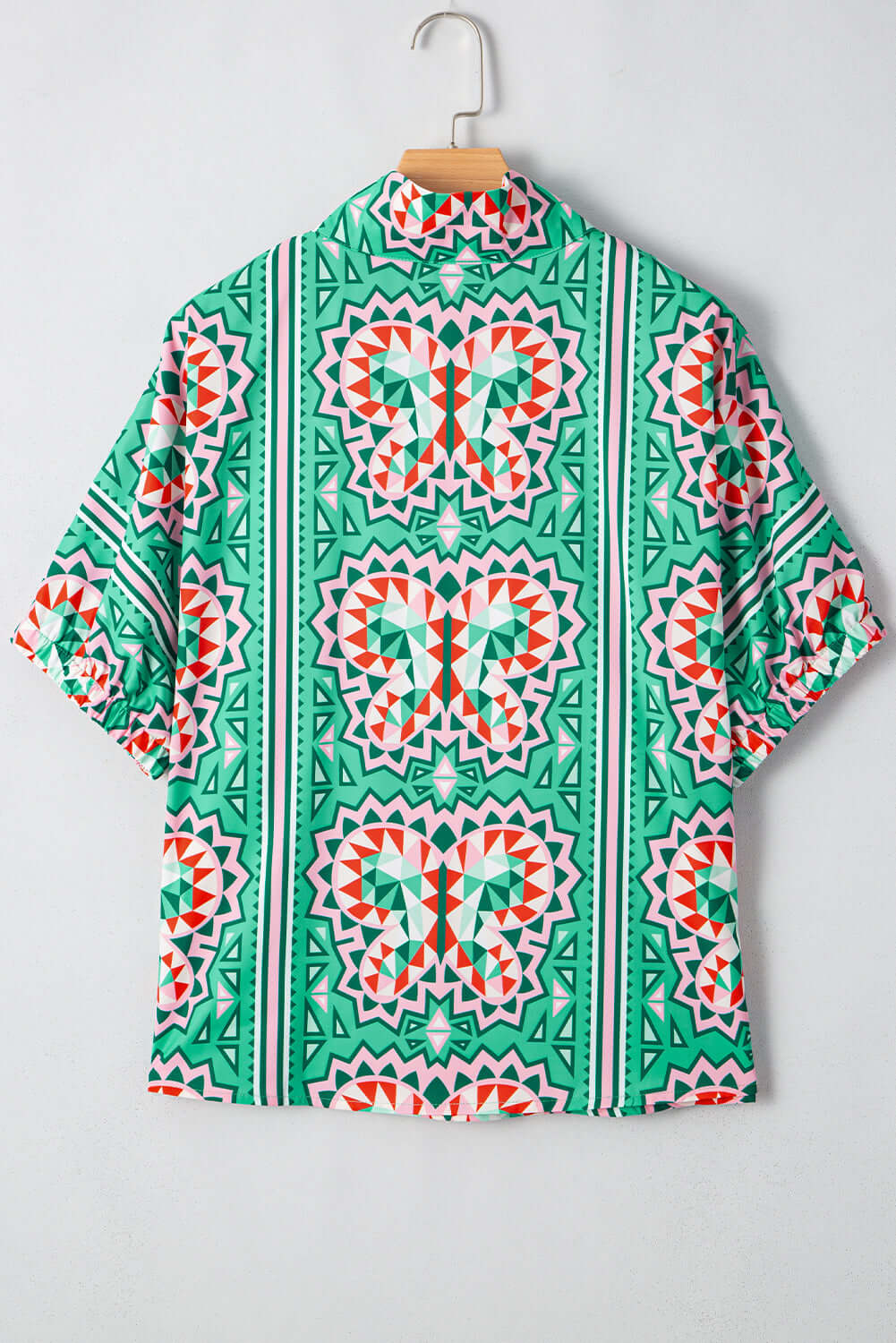 Abstract Energy Top featuring vibrant sea green boho geometric print, back view with striped collar.
