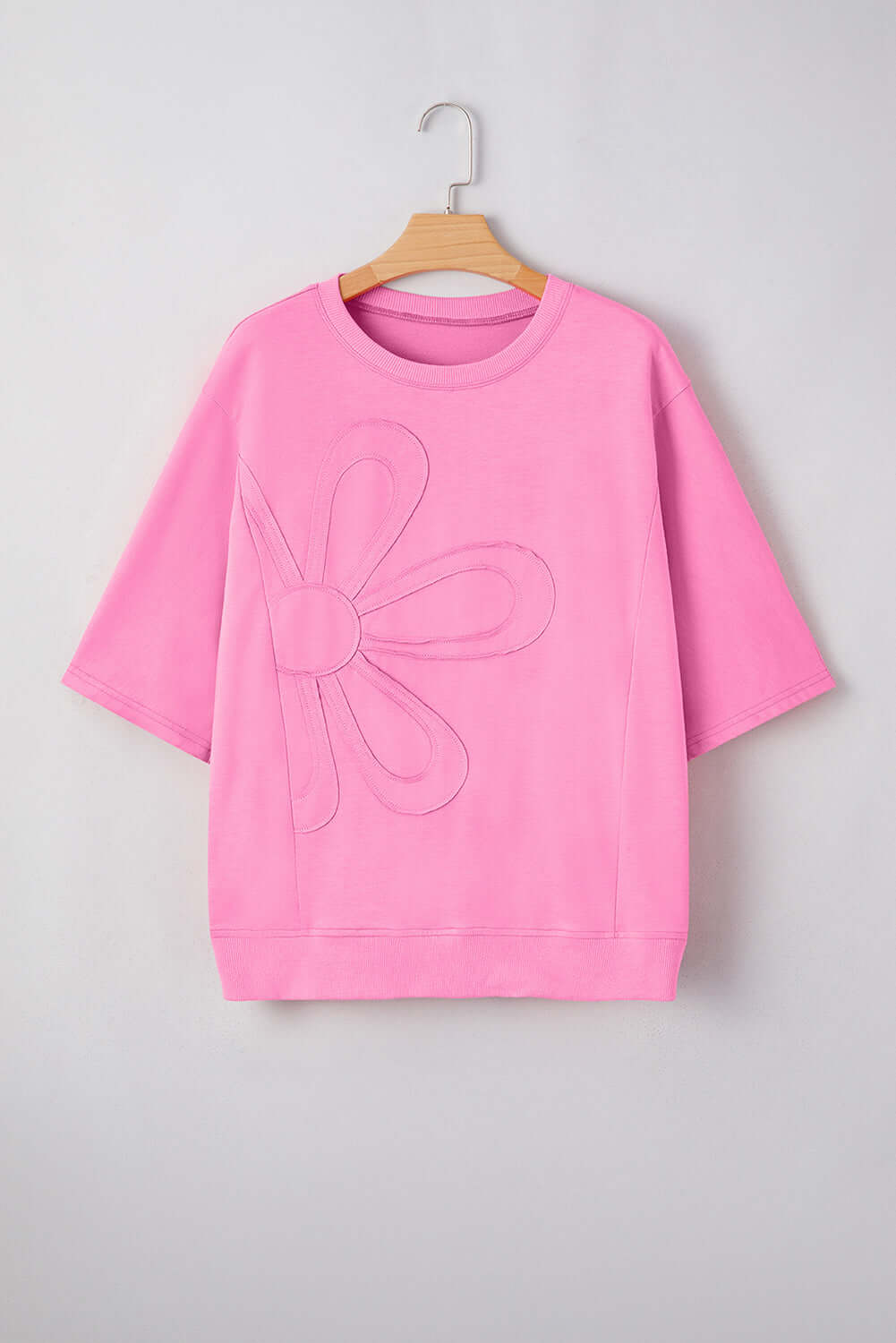 Flower Theory Top in taffy pink with oversized floral design and relaxed fit for casual style.