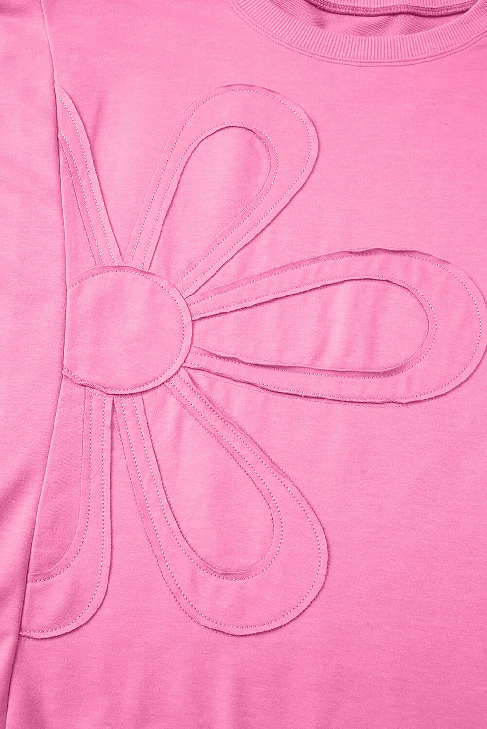 Taffy pink Flower Theory Top featuring an oversized stitched floral design for a playful look.