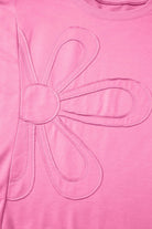 Taffy pink Flower Theory Top featuring an oversized stitched floral design for a playful look.