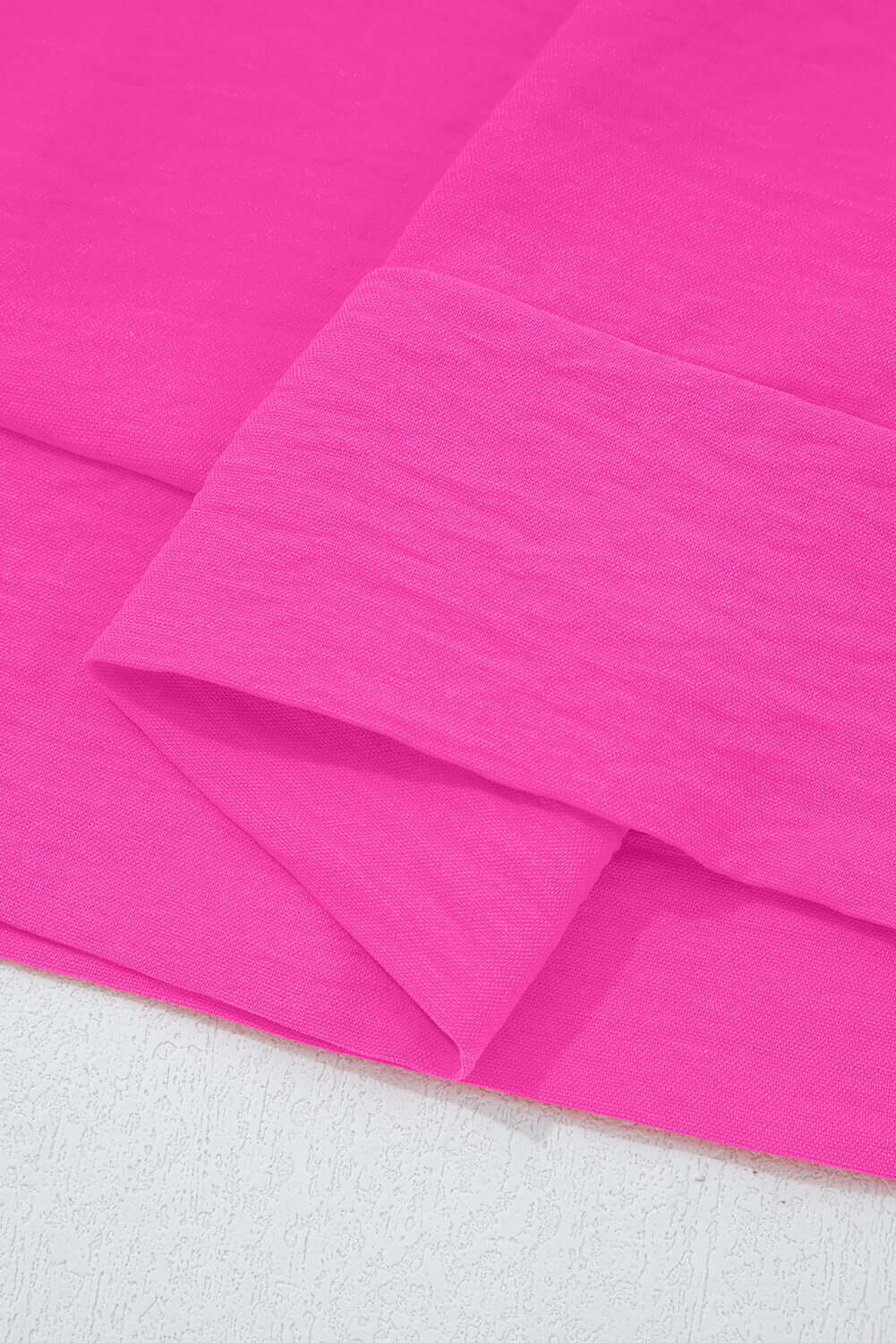 GRACEFUL GLOW TOP (bright pink) fabric close-up showcasing vibrant color and texture.