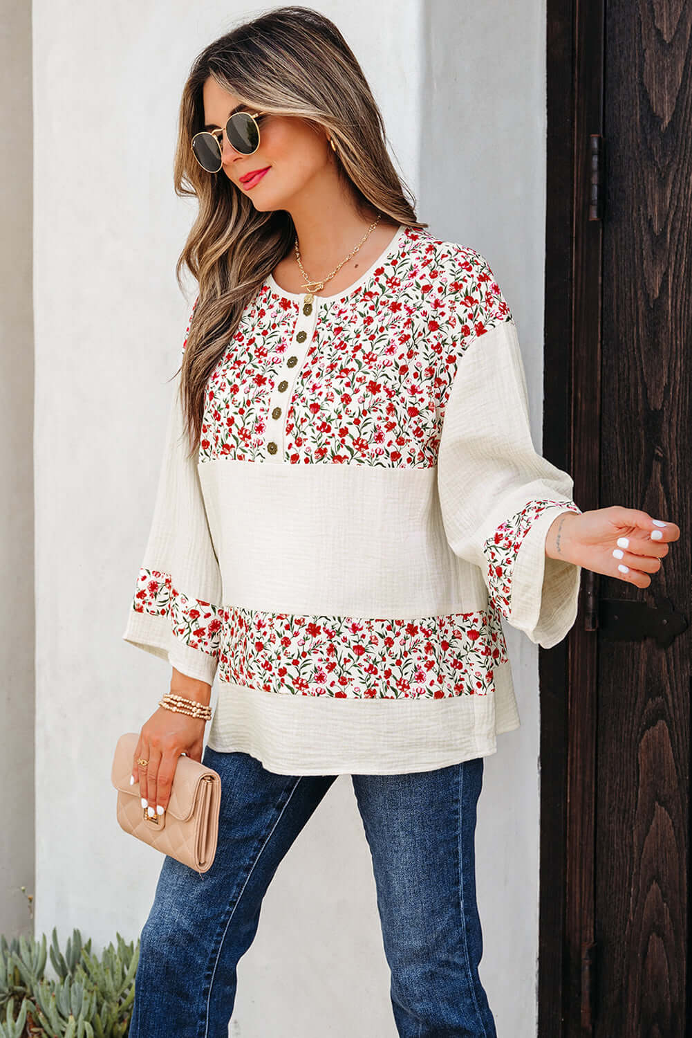 CROSSROADS CUTIE blouse featuring floral patchwork design, Henley button neckline, and 3/4 sleeves for effortless style.