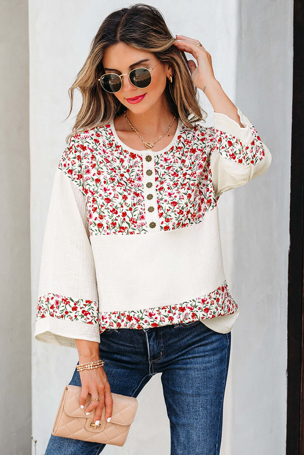 CROSSROADS CUTIE blouse with floral design, lightweight gauze, and Henley button neckline, styled for effortless elegance.