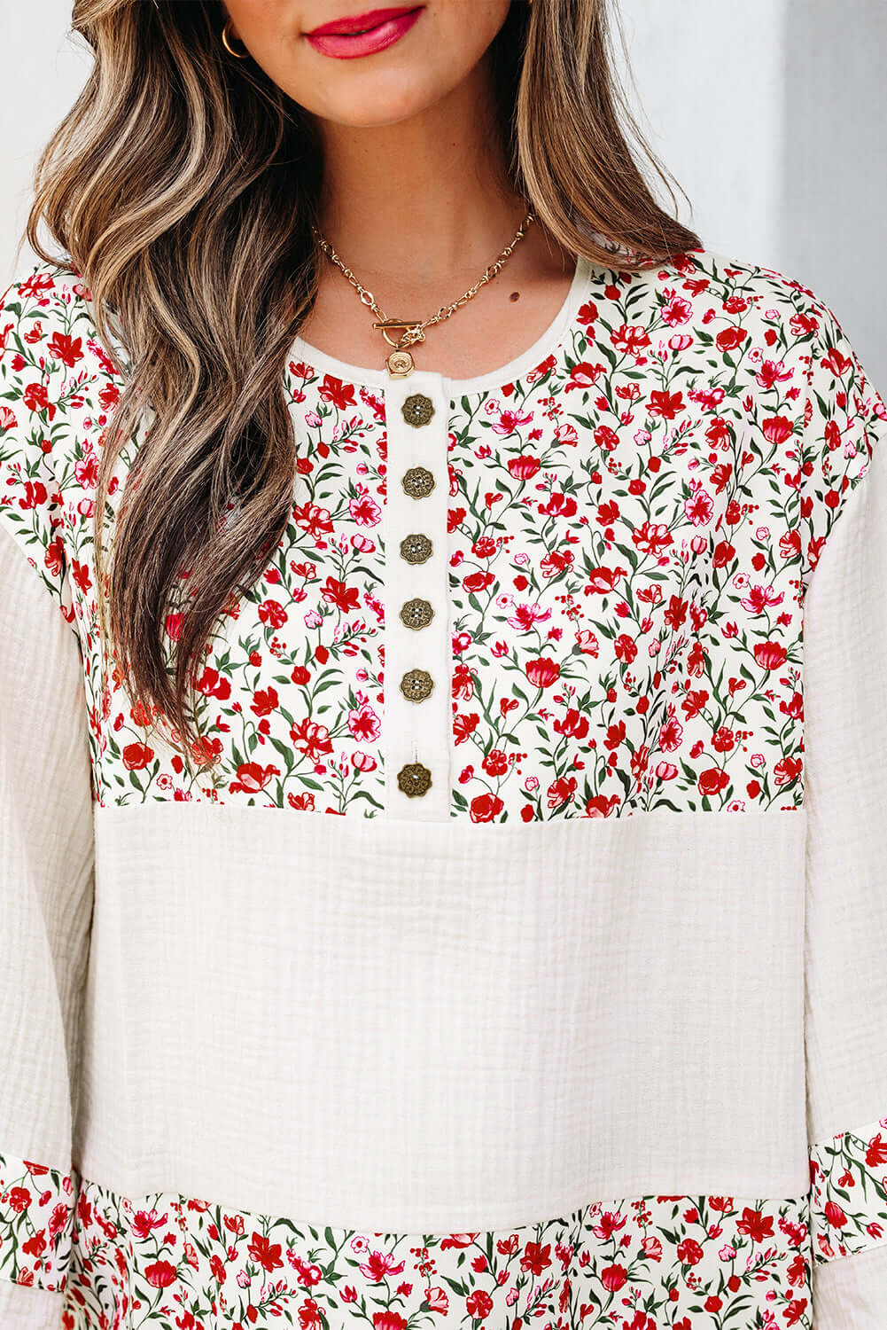CROSSROADS CUTIE Blouse featuring floral print, Henley button neckline, and 3/4 sleeves for effortless elegance and comfort.