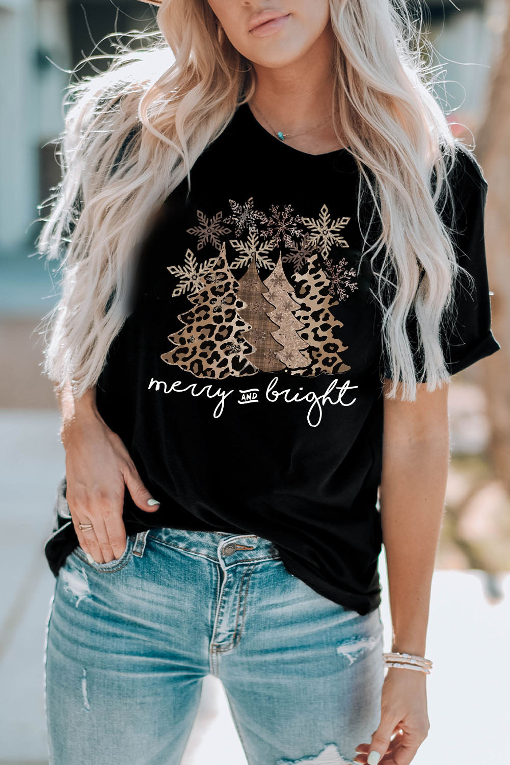 Merry & Bright Leopard Tee featuring festive tree graphic and leopard print on a black tee, perfect for holiday style.
