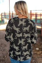 Back view of the Cant Be Tamed long-sleeved top featuring a lively cheetah print, perfect for stylish outfits.