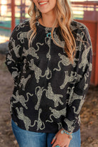 Woman wearing a stylish cheetah print long-sleeved top, showcasing a bold design and comfortable fit. Perfect for any outfit.