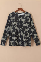 Long-sleeved cheetah print top in soft fabric, perfect for layering or styling with jeans or a skirt.