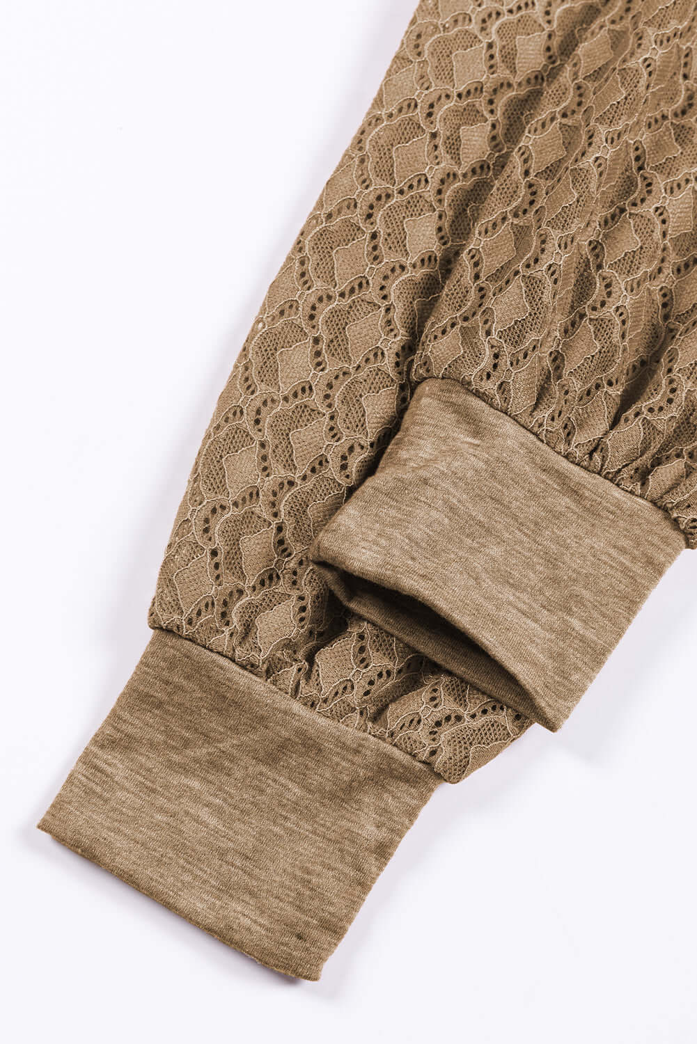 Close-up of MOVING ON Top by Vivian-Lu featuring intricate lace detailing and soft fabric cuffs.